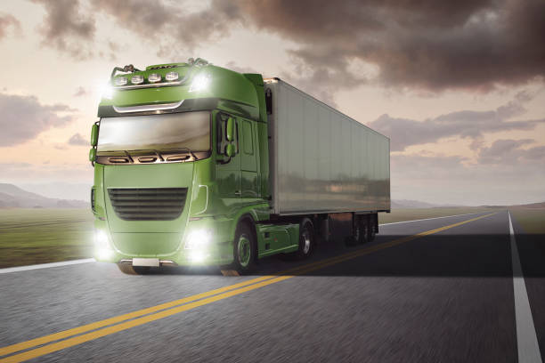 istock Truck with a trailer driving on a highway. 1124380336