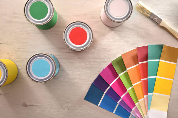 istock Colored paints and color palette on table for renovation 1124381754