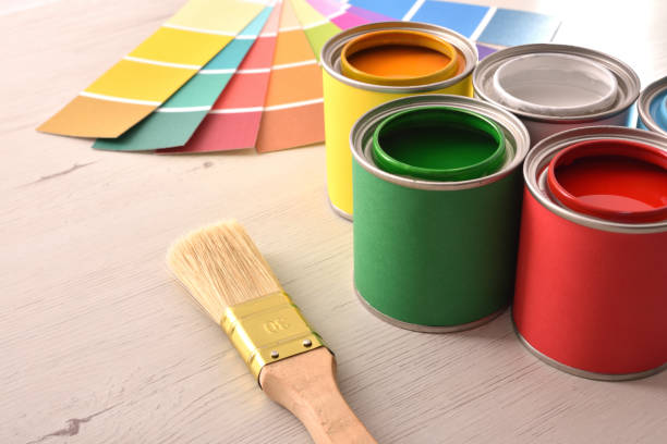 istock Colorful paint pots open and color palette elevated view 1124381763