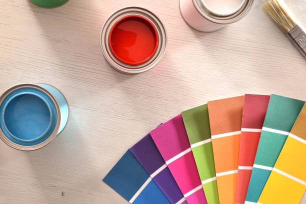 istock Colorful paint pots open and color palette top close up 1124381765