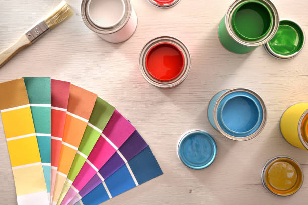 istock Colorful paint pots open and color palette top view 1124381772