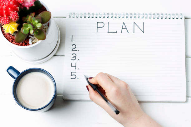 istock Inscription Plan in notepad, close-up, top view, concept of planning, goal setting 1124382866