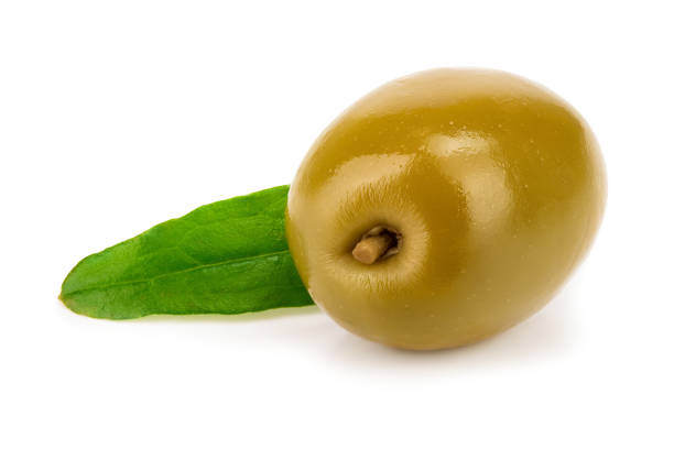 istock Green olives with leaves isolated on a white background 1124385944