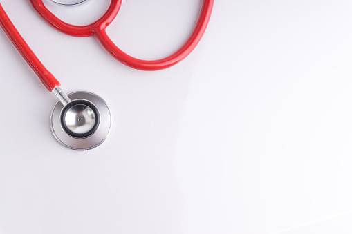 Stethoscope On White Background with selective focus and crop fragment