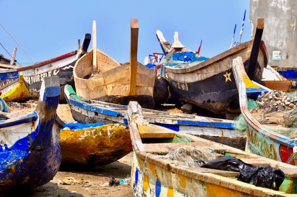 istock Fishing Boats Moored At Beach Against Sky 1124391319