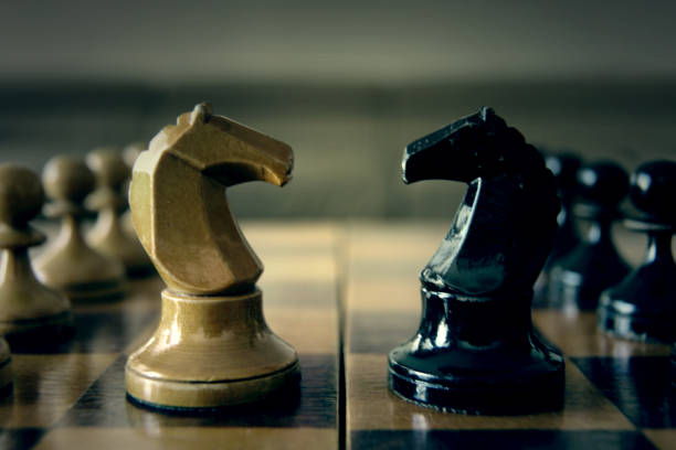 White Chess Pieces on Black Background