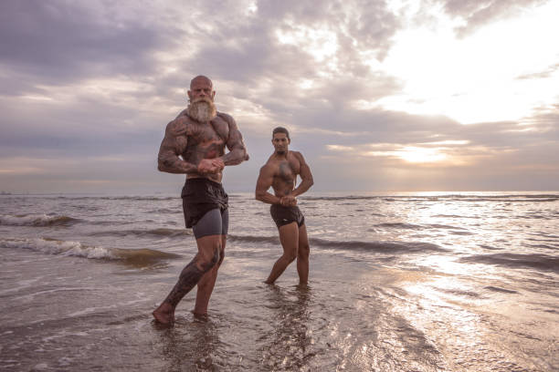 istock Tattooed Senior Man coaching young man During Workout 1124394058