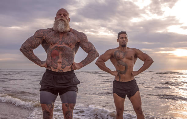 istock Tattooed Senior Man coaching young man During Workout 1124394206