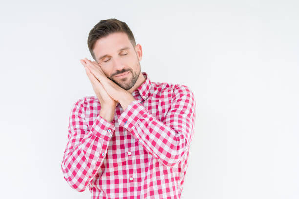 Tough looking handsome guy takes a deep breath with the head backwards and enjoying the life. Copyspace for text on white.