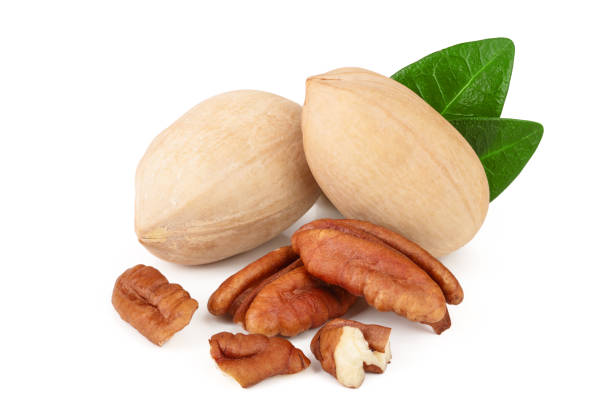 istock pecan nut with green leaves isolated on white background 1124395627