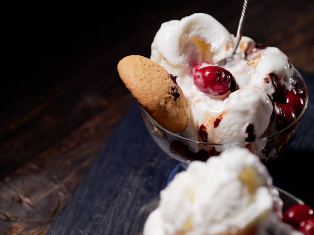 istock Vanilla ice cream with cranberries and cookies 1124395767