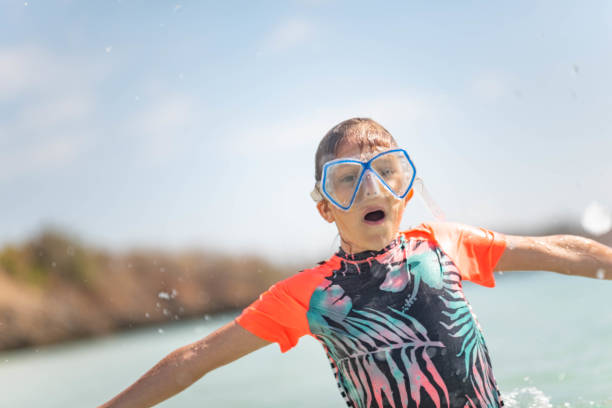 istock Girl playing in the sea 1124395866