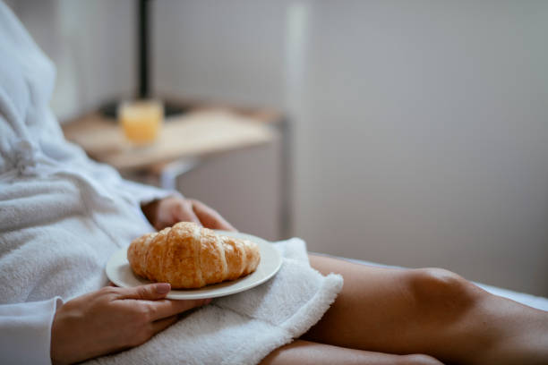 istock Young women having croissant 1124403283