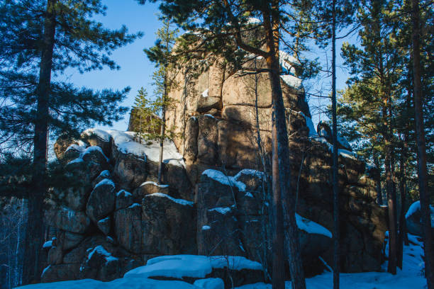 istock lonely rock in winter 1124403324