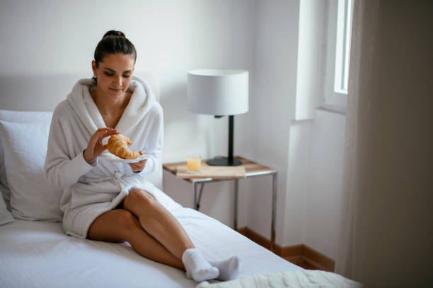 istock Young women having croissant 1124403470