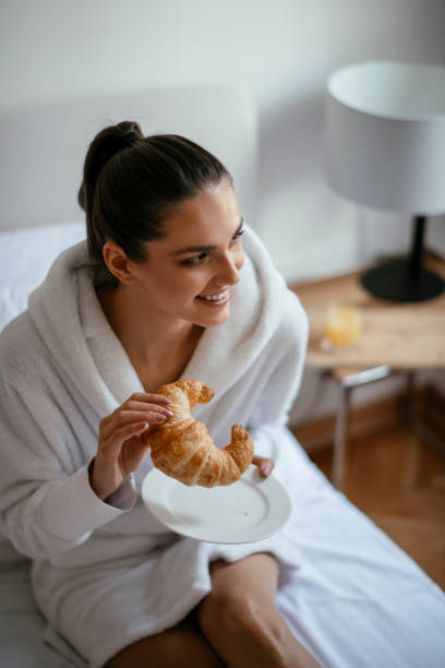 istock Young women having croissant 1124403666