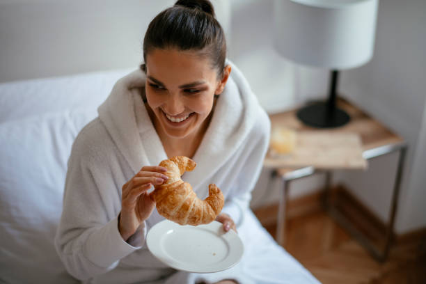 istock Young women having croissant 1124404281