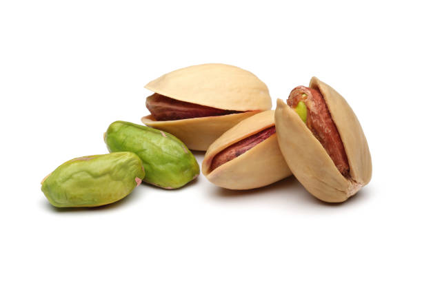istock Peeled and whole pistachio nuts 1124404306