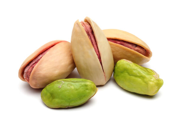 istock Peeled and whole pistachio nuts 1124404373
