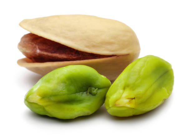 istock Peeled and whole pistachio nuts 1124404719