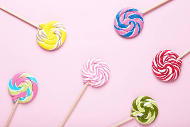 istock Colorful lollipops on pink background 1124405132