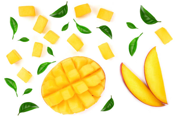 istock Mango fruit decorated with leaves isolated on white background close-up. Top view. Flat lay 1124407883