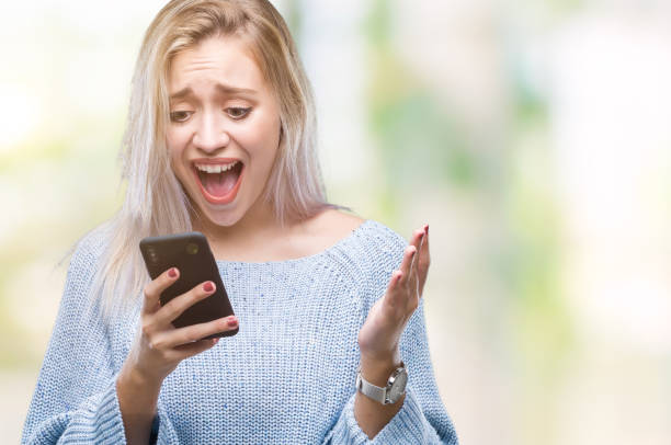 istock Young blonde woman texting sending message using smartphone over isolated background very happy and excited, winner expression celebrating victory screaming with big smile and raised hands 1124409290