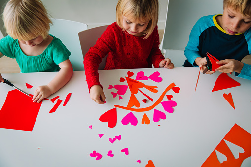 kids making hearts from paper, prepare for valentine day, kids crafts