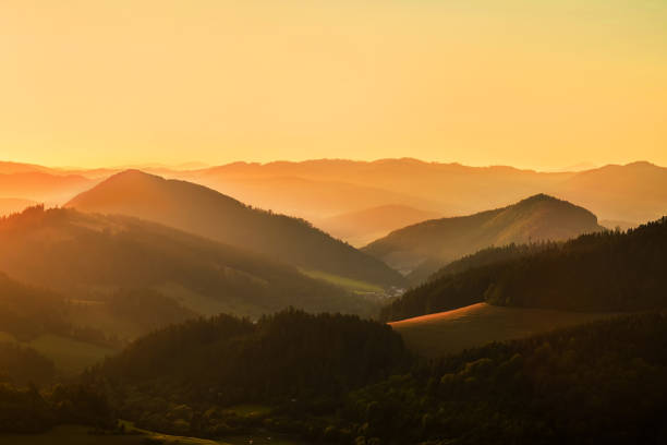 istock Beautiful sunset view around mountains. Sunlight on the sky with sun and cloud. 1124415527