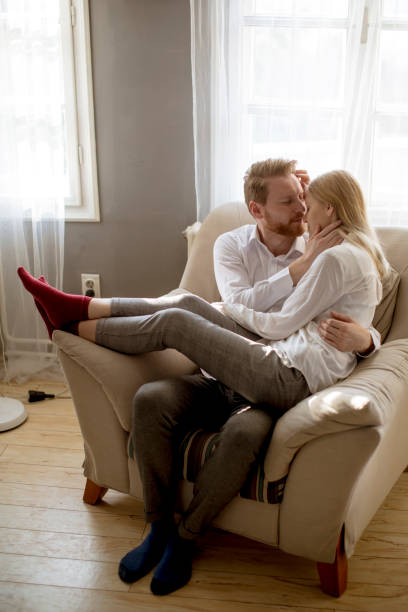 istock Young loving couple on the sofa 1124417225