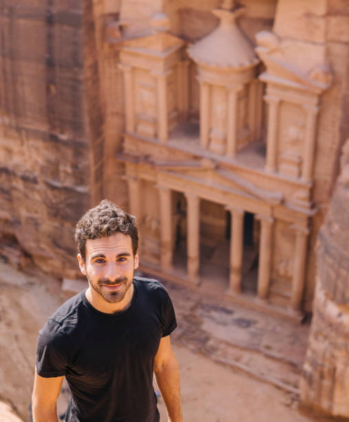 istock Young man hiking in Petra, Jordan 1124418153