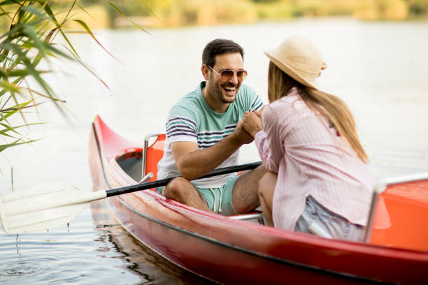 istock Loving couple rowing on the lake 1124418290