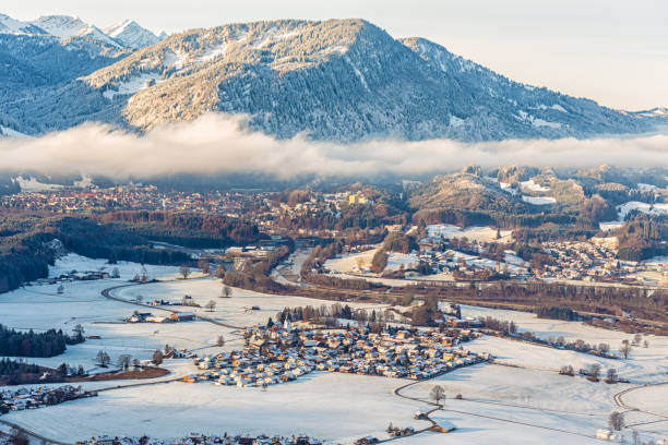 istock Small valley with village in Bavaria at winter 1124420097