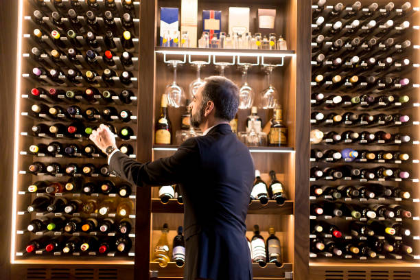 istock Man chooses a bottle of wine 1124420227