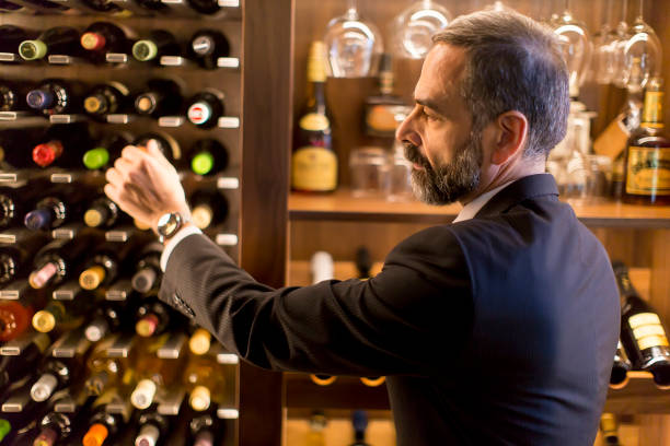 istock Man chooses a bottle of wine 1124420232