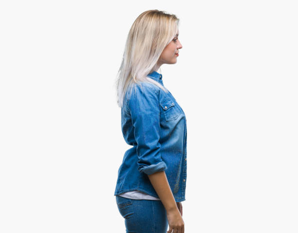 istock Young blonde woman over isolated background looking to side, relax profile pose with natural face with confident smile. 1124422005