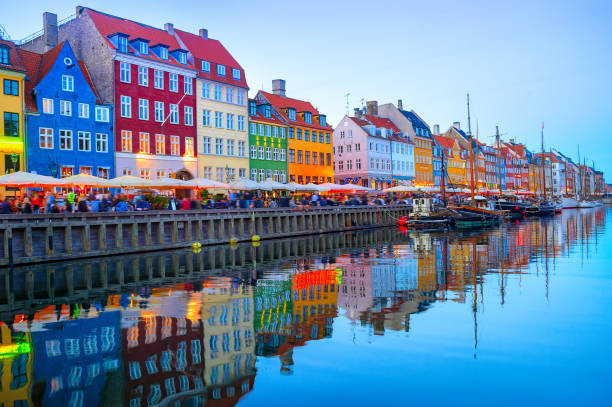 istock illuminated Nyhavn embankment by canal 1124424172