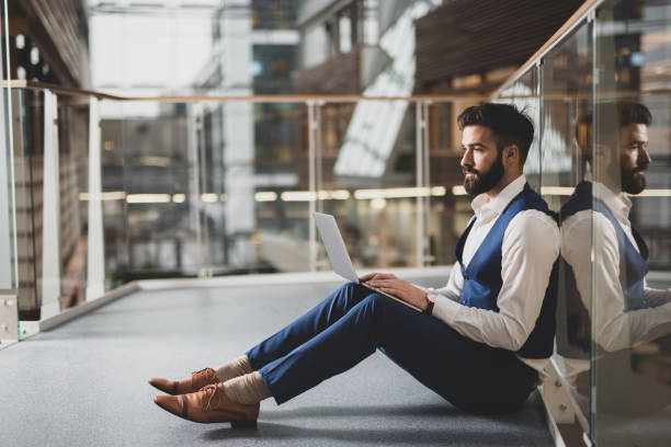 istock Young businessman working in modern building. 1124425579