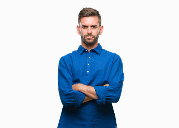 istock Young handsome man over isolated background skeptic and nervous, disapproving expression on face with crossed arms. Negative person. 1124426823