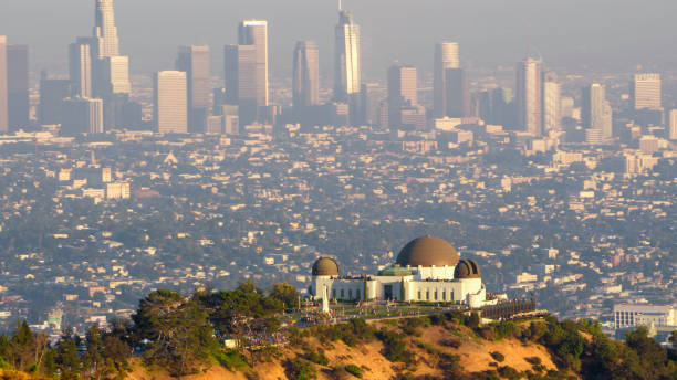 View of Griffith Observatory on Mount Lee Aerial view of Griffith Observatory on Mount Lee and modern skyline in background, Los Angeles, California, USA. griffith park observatory stock pictures, royalty-free photos & images