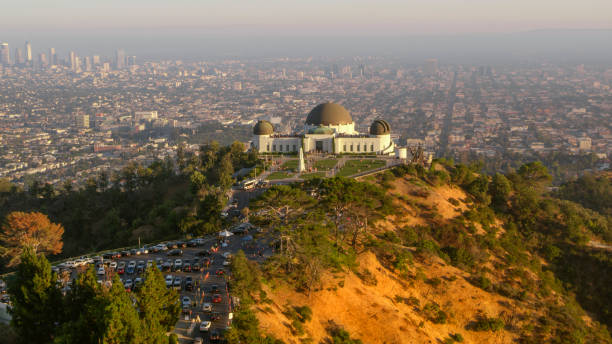 View of Griffith Observatory on Mount Lee Aerial view of Griffith Observatory on Mount Lee and cityscape in background, Los Angeles, California, USA. griffith park observatory stock pictures, royalty-free photos & images