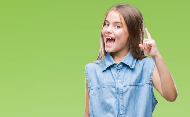 istock Young beautiful girl over isolated background pointing finger up with successful idea. Exited and happy. Number one. 1124432021