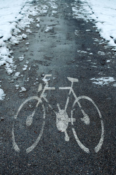istock Bicycle lane sign in snow 1124433468