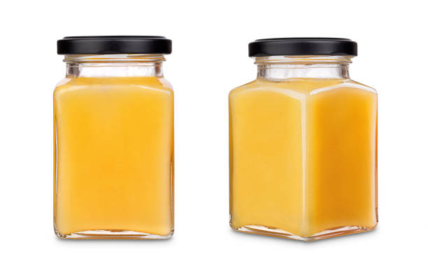 Square jar of honey with black cap