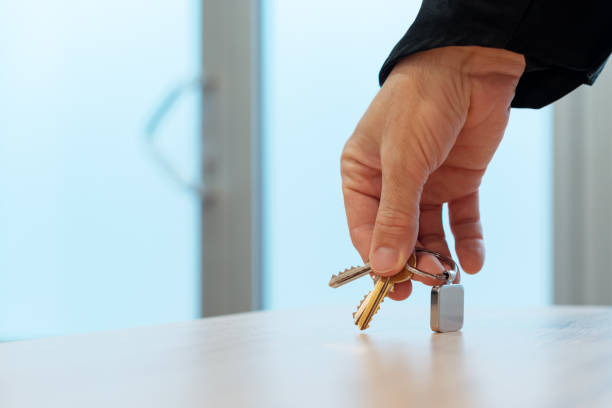 istock Hand grabbing house keys and leaving home 1124434119