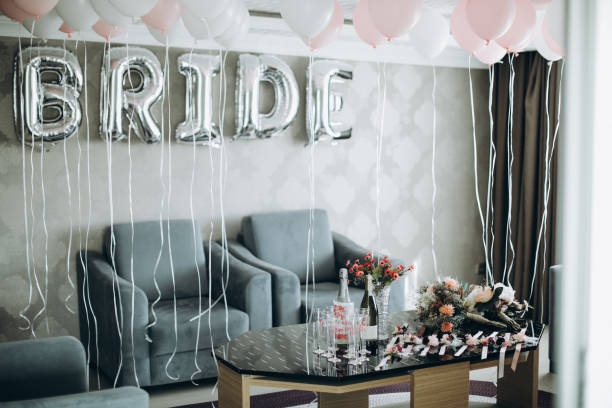 istock Bride letter balloons in hotel room 1124434604