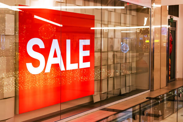 istock Sale banner in shop window 1124434754