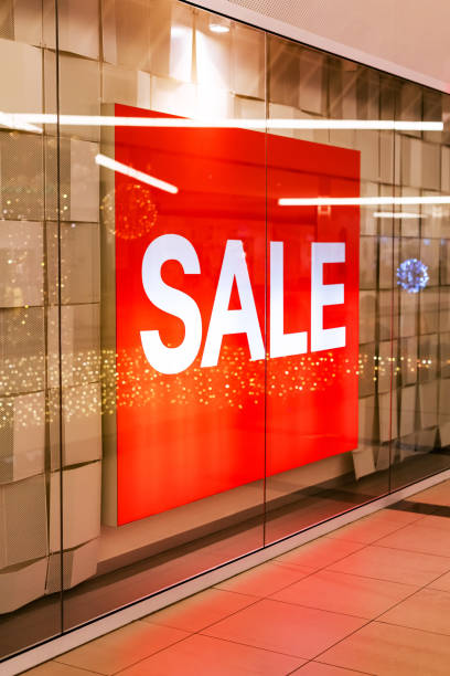 istock Sale banner in shop window 1124434848
