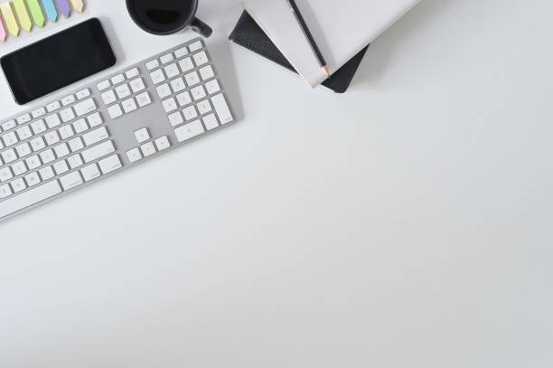 istock Flat lay top view office desk. Workspace with keyboard and office supplies with coffee on white table. 1124434895