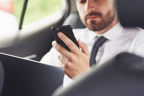 istock Man is a man working on a laptop and testing on mobile devices. 1124435690